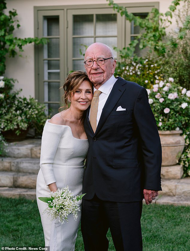 Rupert Murdoch and his fifth wife Elena Zhukova pose for photos after their wedding at his California vineyard on Saturday